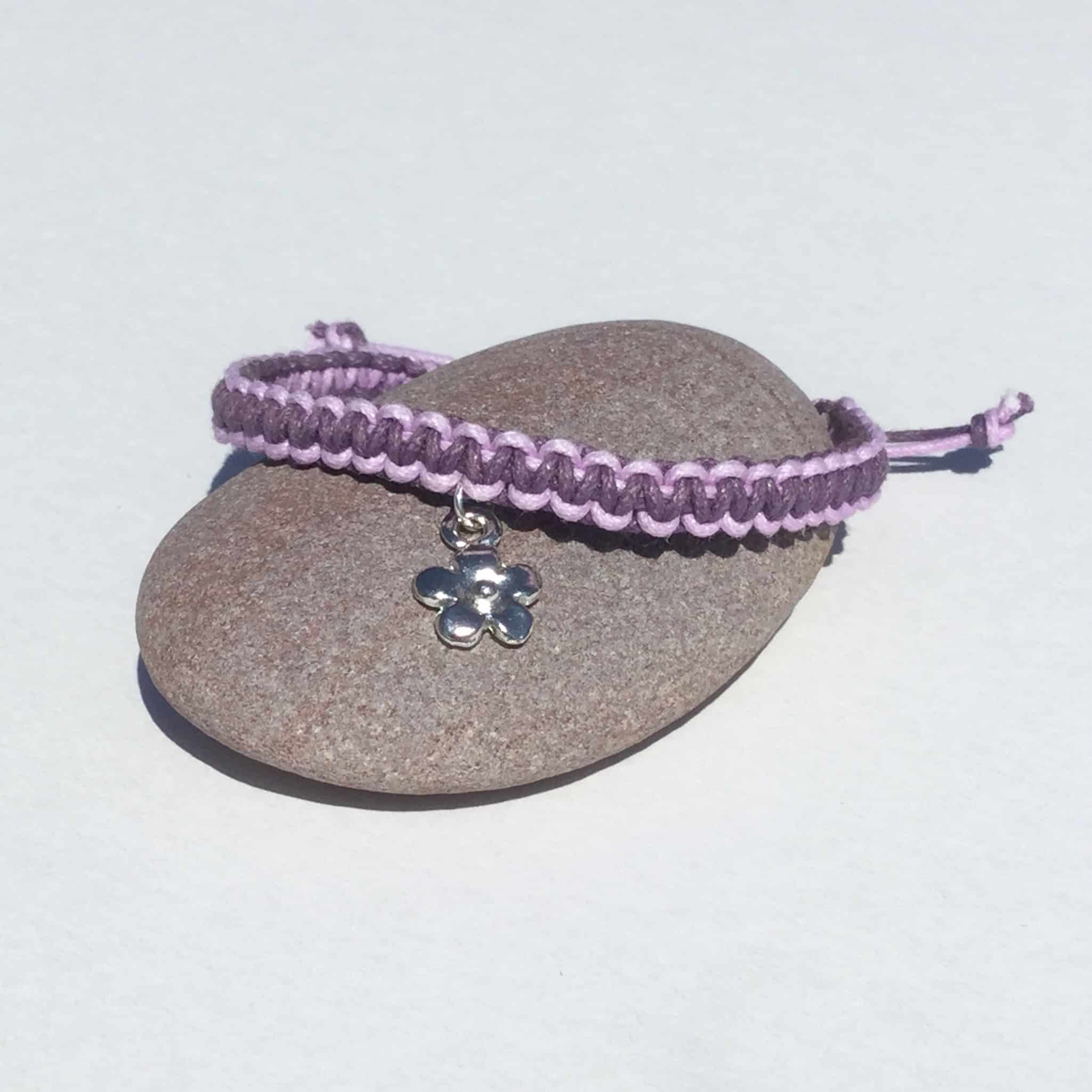 IMG_2890 Purple and lilac cotton macrame friendship bracelet with a metal daisy charm.